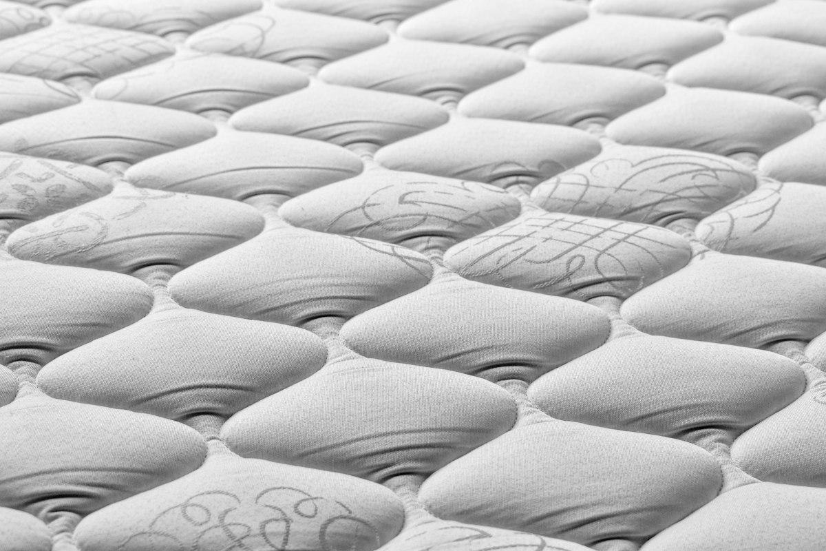 Close-up of a quilted mattress surface texture